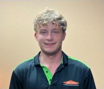 Young blonde man in a SERVPRO polo