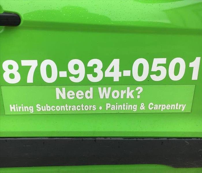 SERVPRO number and advertising on the side of a vehicle 