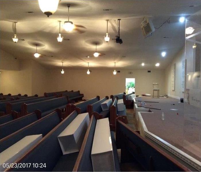church seats filled with white cylinders 