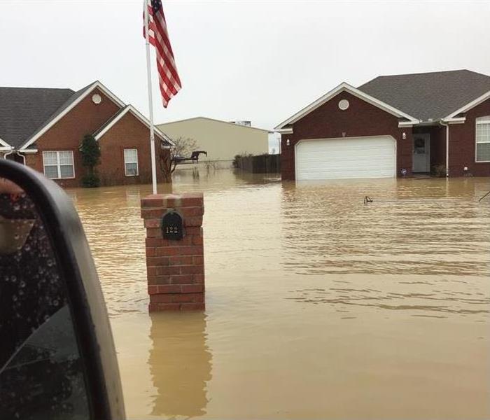 exterior of two homes that have flooded 