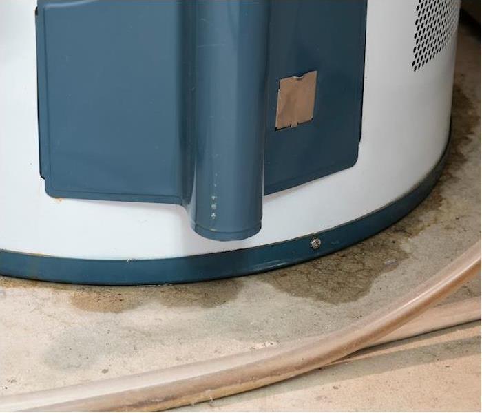 img src =”water heater” alt = " a blue and white hot water heater showing signs of a water leak ” >