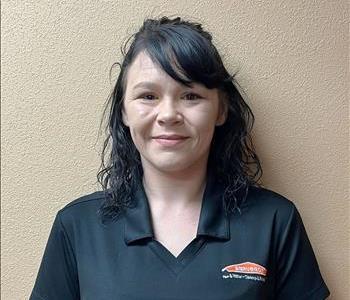 Female employee in a black SERVPRO shirt