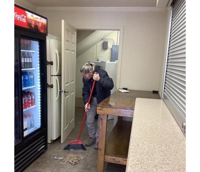 Donna sweeping the concession stand out at Nettleton High School